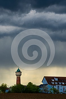 Dark stormclouds over city