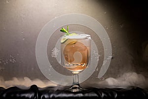 dark and stormy rum cocktail with Lime against background of smoke