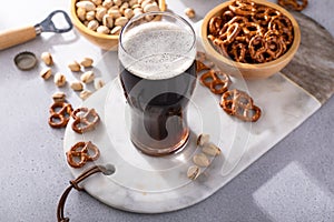 Dark stout beer in a tall glass on the table