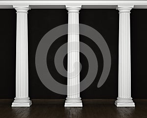 Dark stucco wall with classical columns and wooden floor