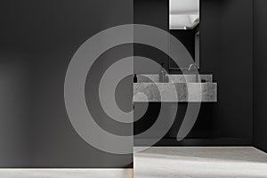 Dark stylish hotel bathroom interior with sink and accessories, mock up wall