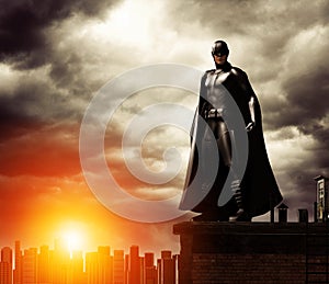 Dark Superhero on rooftop overlooking cityscape