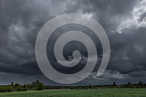 Dark, swirling, threatening clouds in the sky.