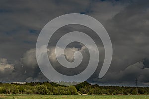 Dark, swirling, threatening clouds in the sky.