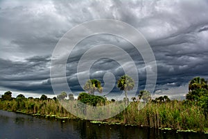 Dark thunder clouds and dramatic storms fill the sky over the sw photo