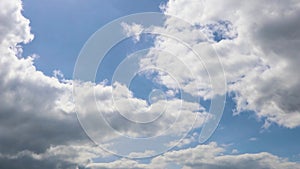 Dark thunderclouds appeared in the clear blue sky. Summer sky and weather change. Sky and clouds Timelapse