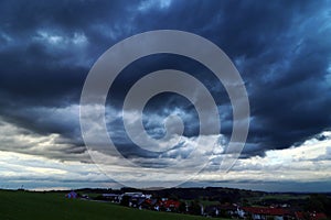 Dark thunderclouds over a small town photo