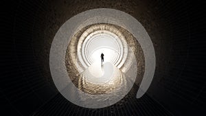 Dark tunnel with a bright light at the end or exit as metaphor to success, faith, future or hope