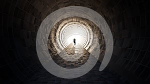 Dark tunnel with a bright light at the end or exit as metaphor to success, faith, future or hope