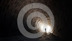 Dark tunnel with a bright light at the end or exit as metaphor to success, faith, future or hope