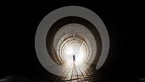 Dark tunnel with a bright light at the end or exit as metaphor to success, faith, future or hope