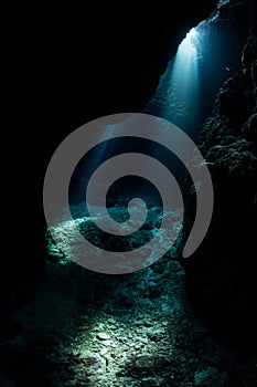 Dark, Underwater Cavern and Beams of Light