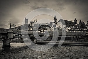 Dark view of Lucerne, the gateway to central Switzerland, sited on Lake Lucerne, is embedded within an impressive mountainous pano