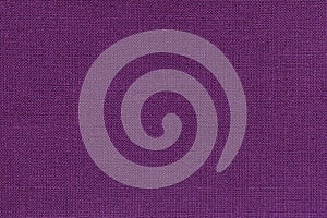 Dark violet background from a textile material with wicker pattern, closeup.