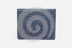 Dark violet berries rice packed in the vacuity packaging