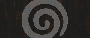 Dark wall background. Empty workplace, in front of an abstract package