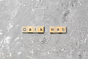 Dark web word written on wood block. Dark web text on cement table for your desing, concept