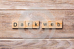 Dark web word written on wood block. Dark web text on wooden table for your desing, concept