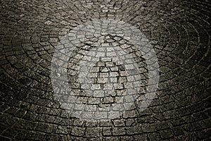 Dark wet cobblestone background