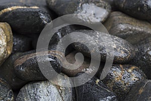 Dark and wet stones for background