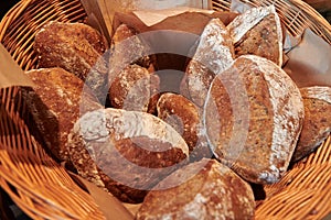 Dark whole grain buns in the basket.