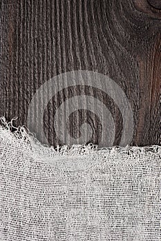 Dark wood and cheesecloth background photo