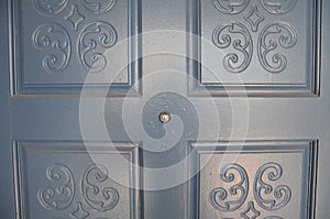 Dark wood door with peephole or spyhole