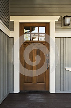 Dark wood front door of a home