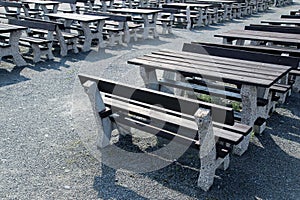 Dark wooden bench in open air restaurant