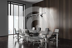 Dark wooden and gray office meeting room corner