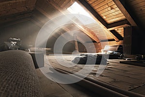 Darken attic with light rays at window