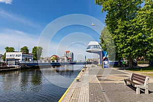 Darlowo, zachodni-pomorskie / Poland - June, 4, 2020: Bridge across the river in the port city. Buildings in the port of Central