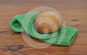 Darning egg with hand-knitted sock