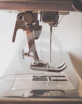 Darning jeans on a sewing machine.