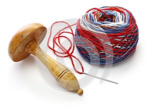 Darning mushroom, yarn ball and needle
