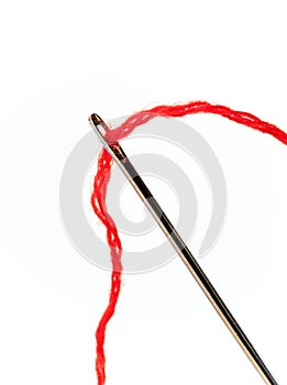 Darning needle and red thread