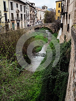 Darro river, paseo de los tristes in Granada, Spain photo