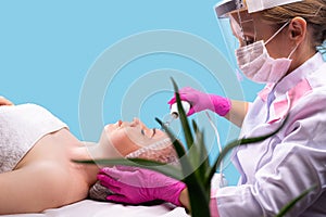 Darsonvalization or rejuvenation of the face with help of electrotherapy, physiotherapy. Current therapy. The patient is