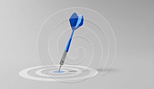 Dart arrow on center of dartboard, metaphor to target success, winner concept,competitive advantage, strategic marketing concept