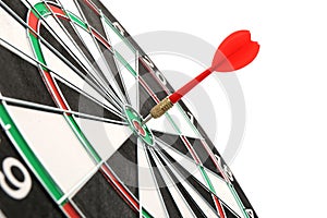 Dart board with color arrow hitting target