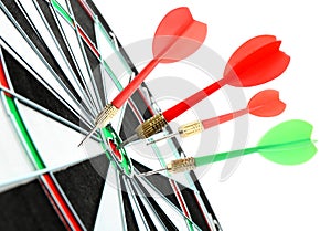 Dart board with color arrows hitting target on white background