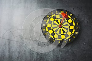 Dart board with red arrows hitting target, closeup