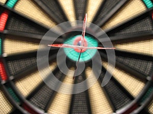 Dart in the center of the dartboard photo