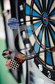 Dart hitting the center bull`s eye