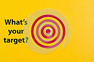 Dartboard drawn on yellow background with question WHAT`S YOUR TARGET