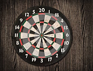 Dartboard on old wooden wall. photo