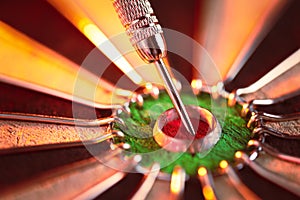 Dartboard showing a dart hit the center bullseye. Concept of success, targeted goal setting and achieving, and aiming for