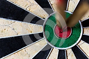 Dartboard with Steeldarts in bullseye