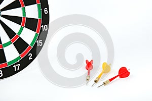 dartboard and three darts on a white background