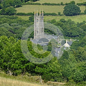 View over Widecombe-in-the-Moor showing the tower of St Pancras Church, Dartmoor, Devon, UK